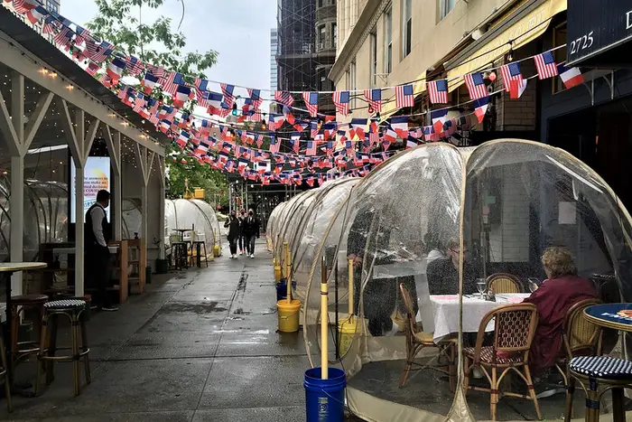 New Yorkers enjoying outdoor dining in the rain